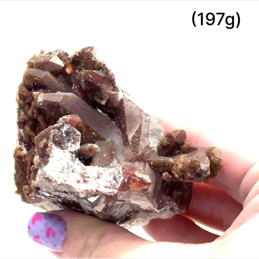 A raw Red Quartz gemstone cluster from Morocco with a rough, crystalline surface and a brownish-red color. The approximate weight range is indicated as 197g. on a white background, front view.