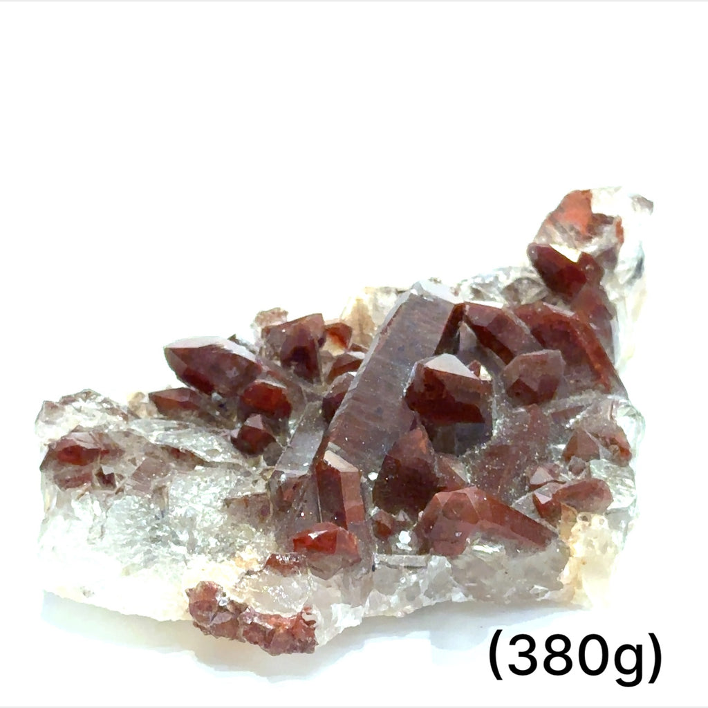 A raw Red Quartz gemstone cluster from Morocco with a rough, crystalline surface and a brownish-red color. The approximate weight range is indicated as 380g. on a white background, front view.