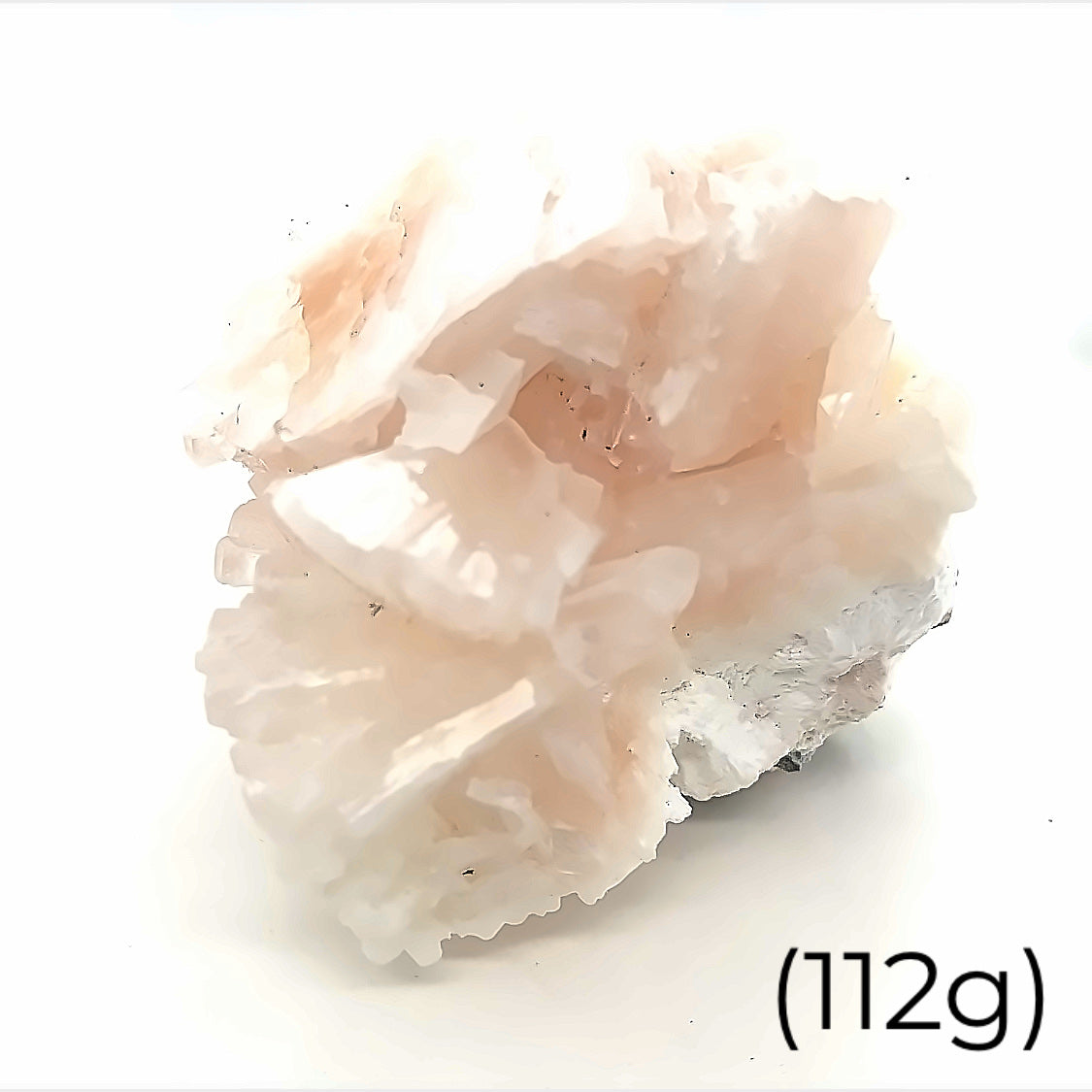 A raw cluster of pink heulandite on mordenite gemstone, with a label indicating its weight as 112 grams on a white background front overview. 

