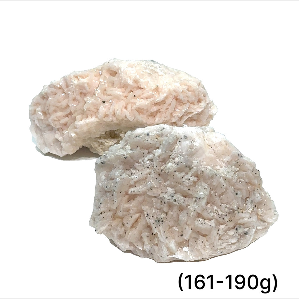 A raw specimen of Pink Dolomite with Chalcopyrite, showing a rough, crystalline texture with specks of color on a white background, in a close-up view (161-190g)