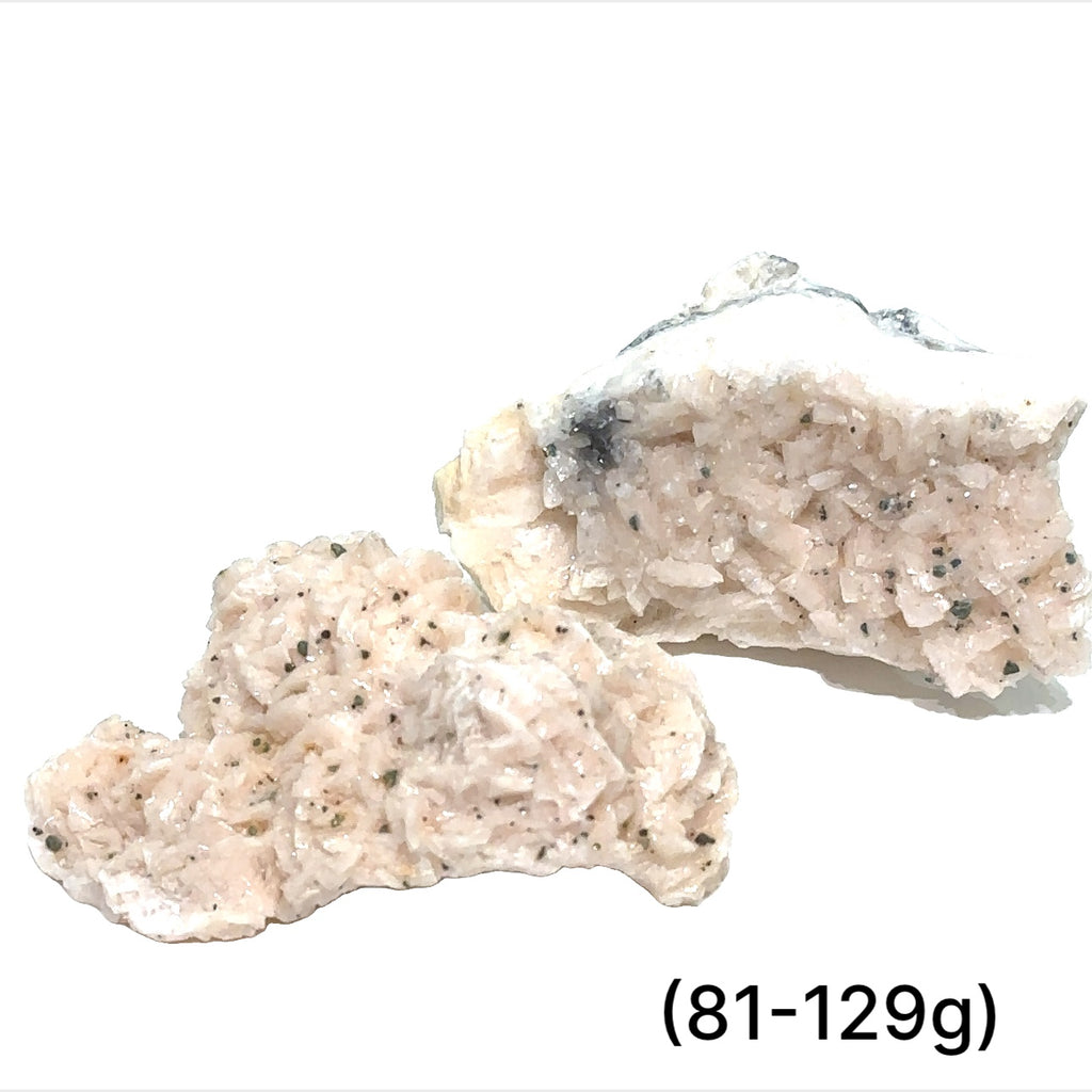 A raw specimen of Pink Dolomite with Chalcopyrite, showing a rough, crystalline texture with specks of color on a white background, in a close-up view (81-129g)