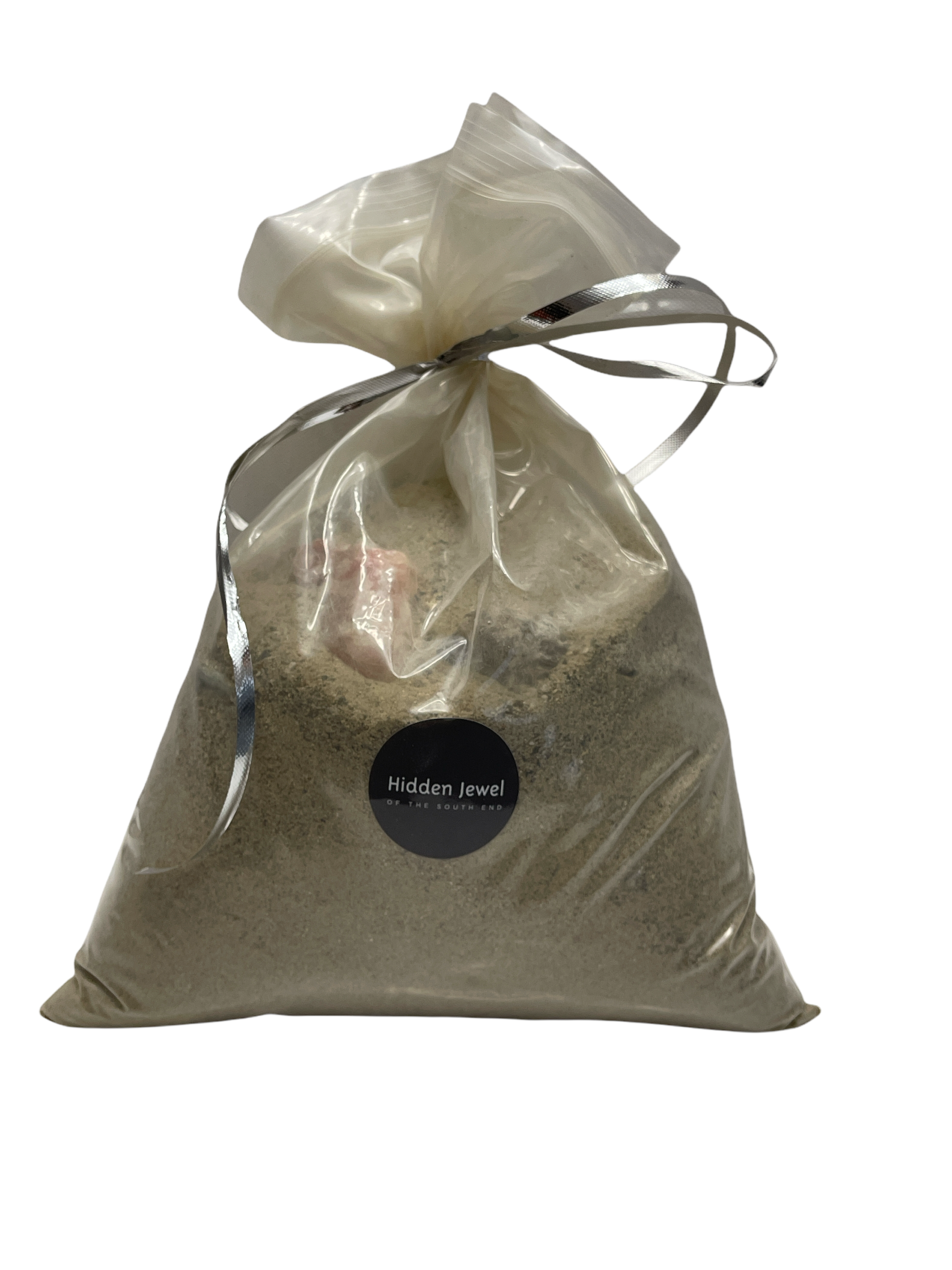 A sealed zipper bag containing raw gemstones, with a label indicating it is a product from Hidden Jewel of the South End on a white background, front view.