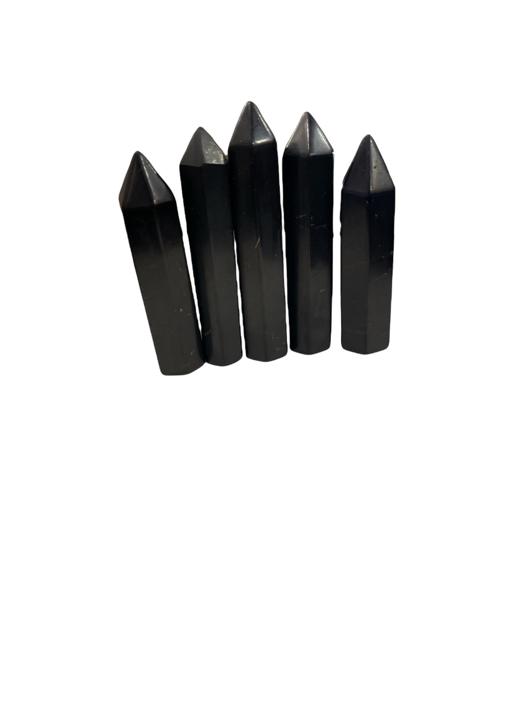 A set of five black Shungite gemstone towers of varying sizes arranged in a line on a white background, front overview.