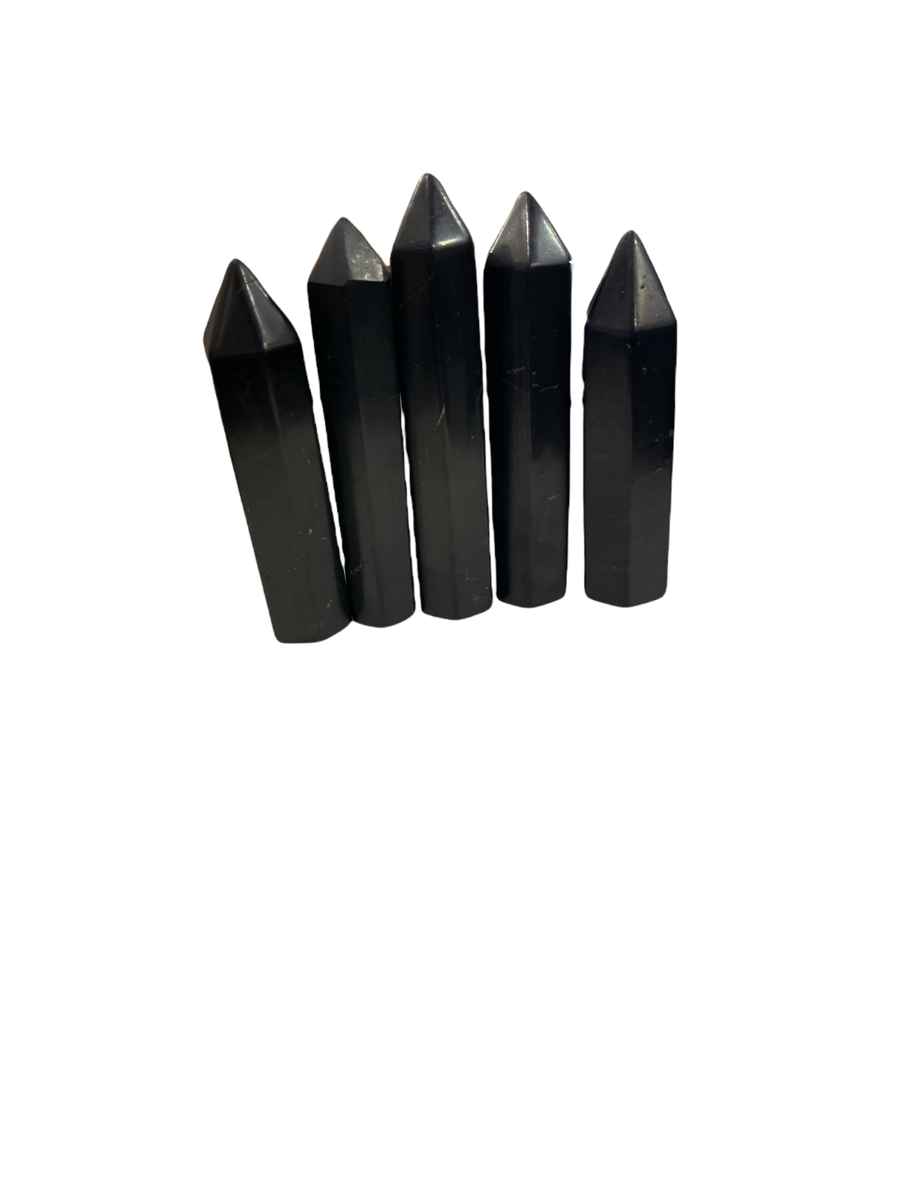A set of five black Shungite gemstone towers of varying sizes arranged in a line on a white background, front overview.