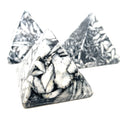 A set of three Pinolith gemstone pyramids with a mottled black and white appearance, displayed on a white background, front overview.