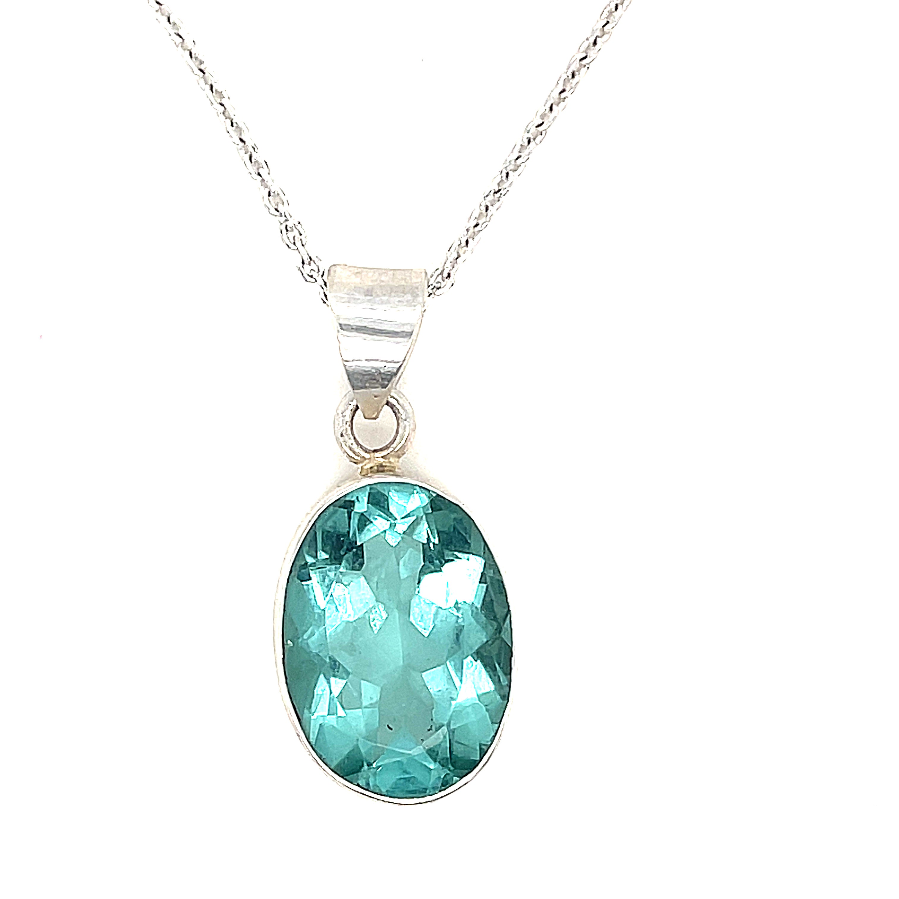 A sterling silver Blue Apatite gemstone  Pendant Necklace on white background, hanging front overview. 