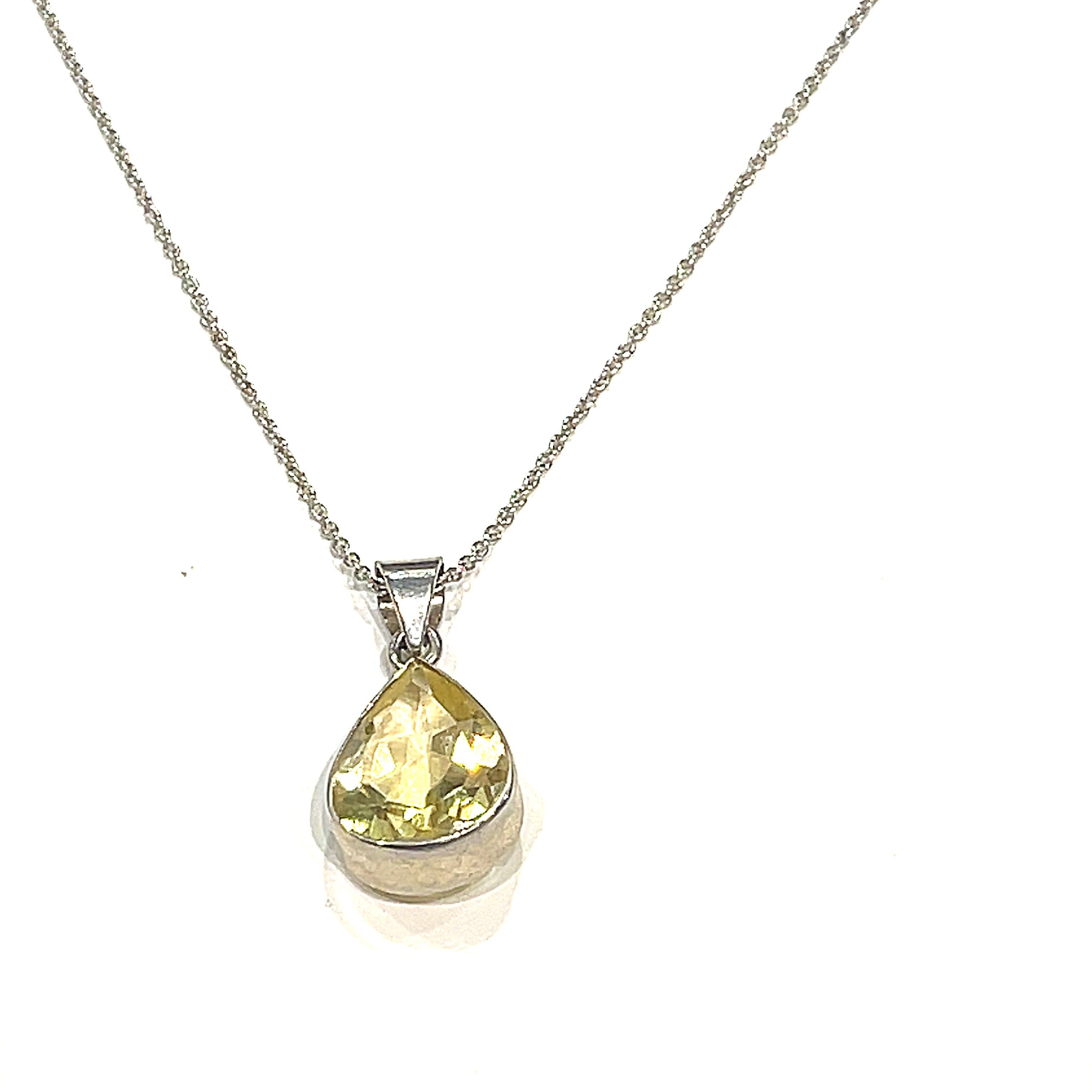 A sterling silver Lemon Quartz gemstone  Pendant Necklace on white background, hanging front overview. 
