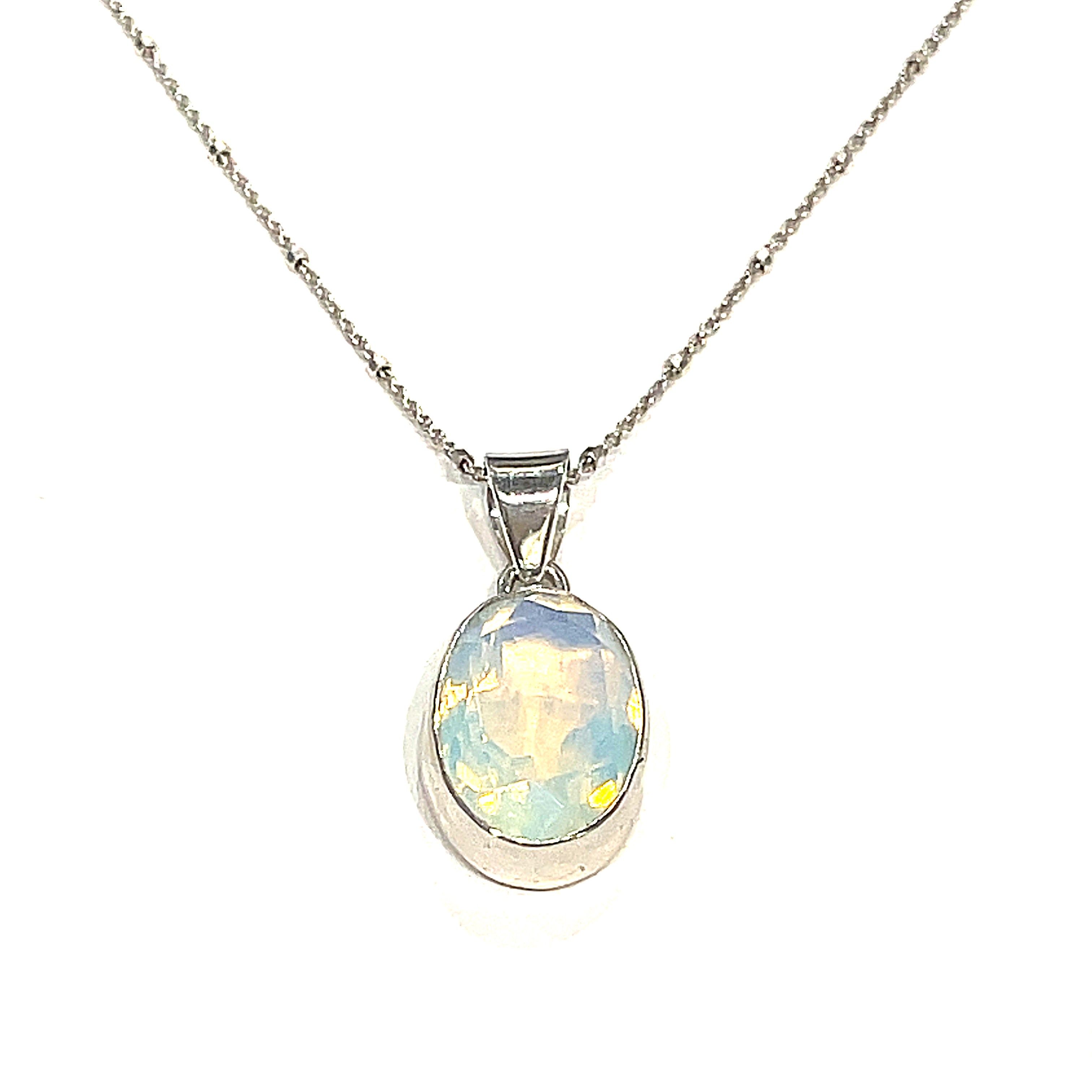 A sterling silver Opalite gemstone  Pendant Necklace on a white background, hanging front overview. 
