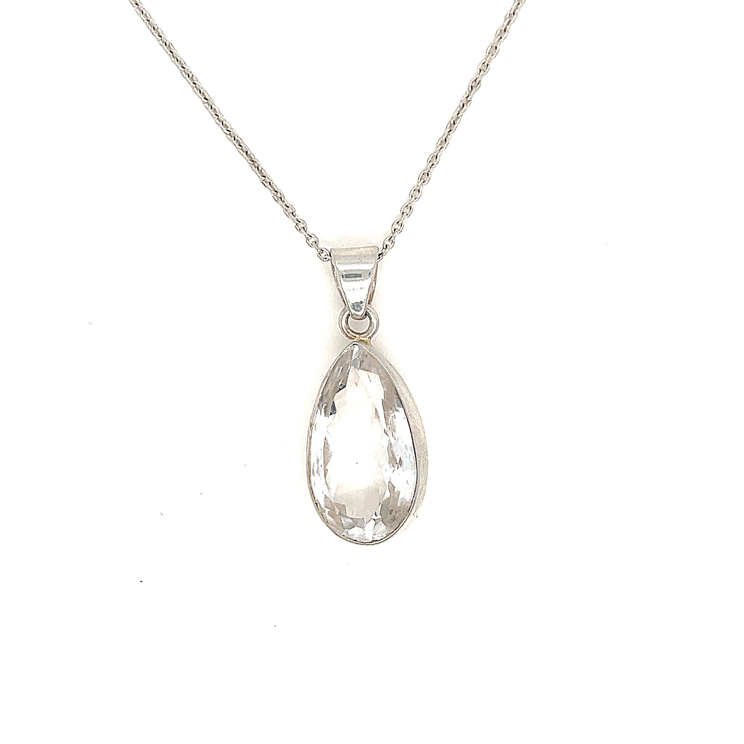 A sterling silver Rock Quartz gemstone  Pendant Necklace on white background, hanging front overview. 