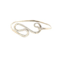 A sterling silver bangle size 7 on a white background, front overview. 
