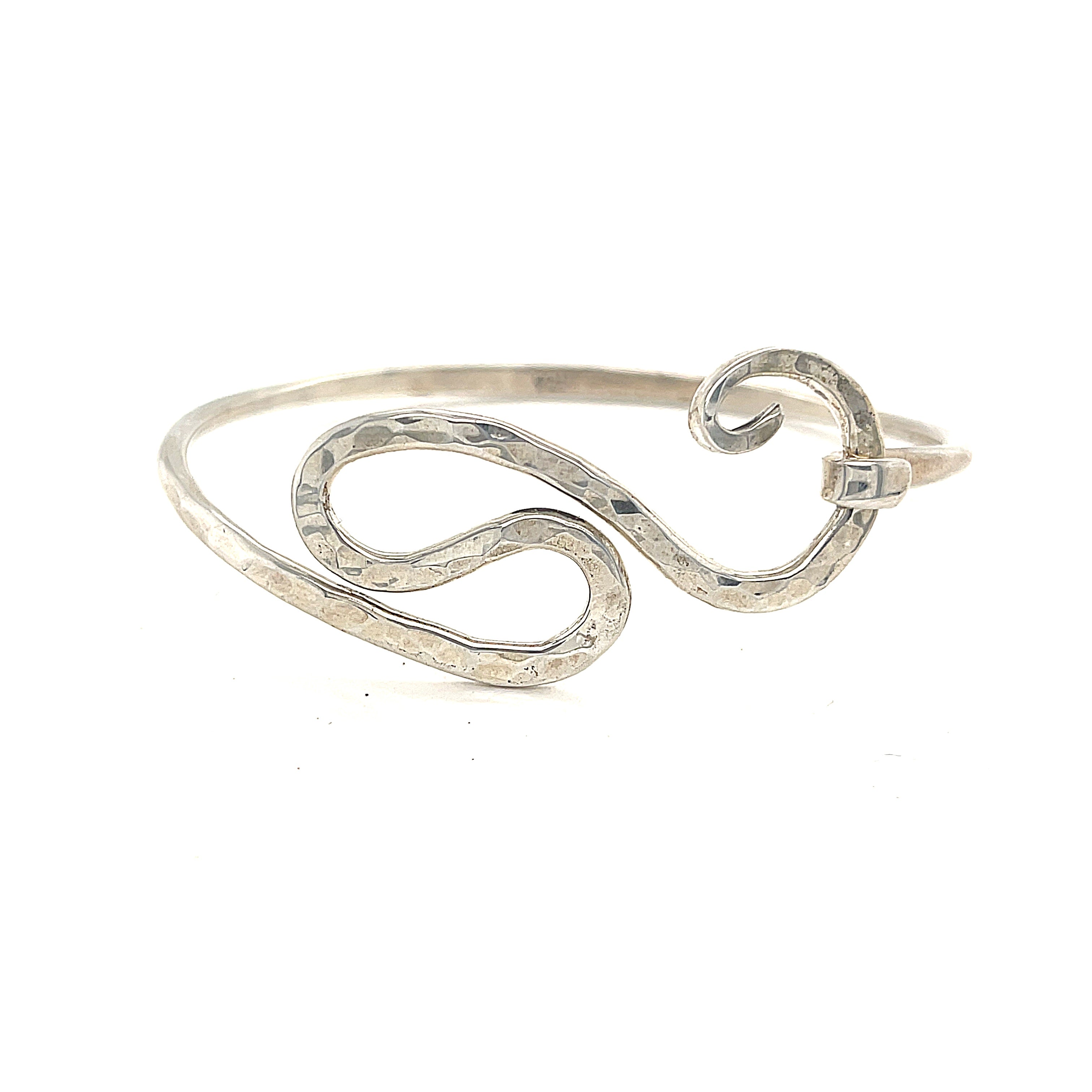 A sterling silver bangle size 7 on a white background, front view. 