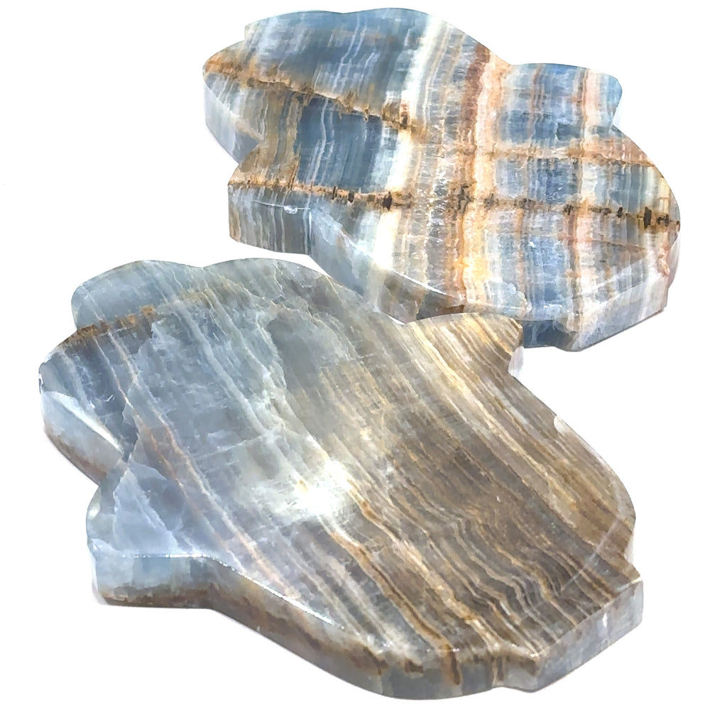 A third set of Two Blue Onyx gemstone carvings in a Hamsa shape with visible blue and white color patterns on a white background front overview