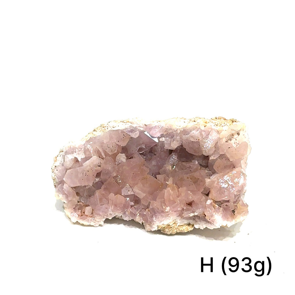 Amethyst cluster displaying translucent quartz and texture on white #H front view