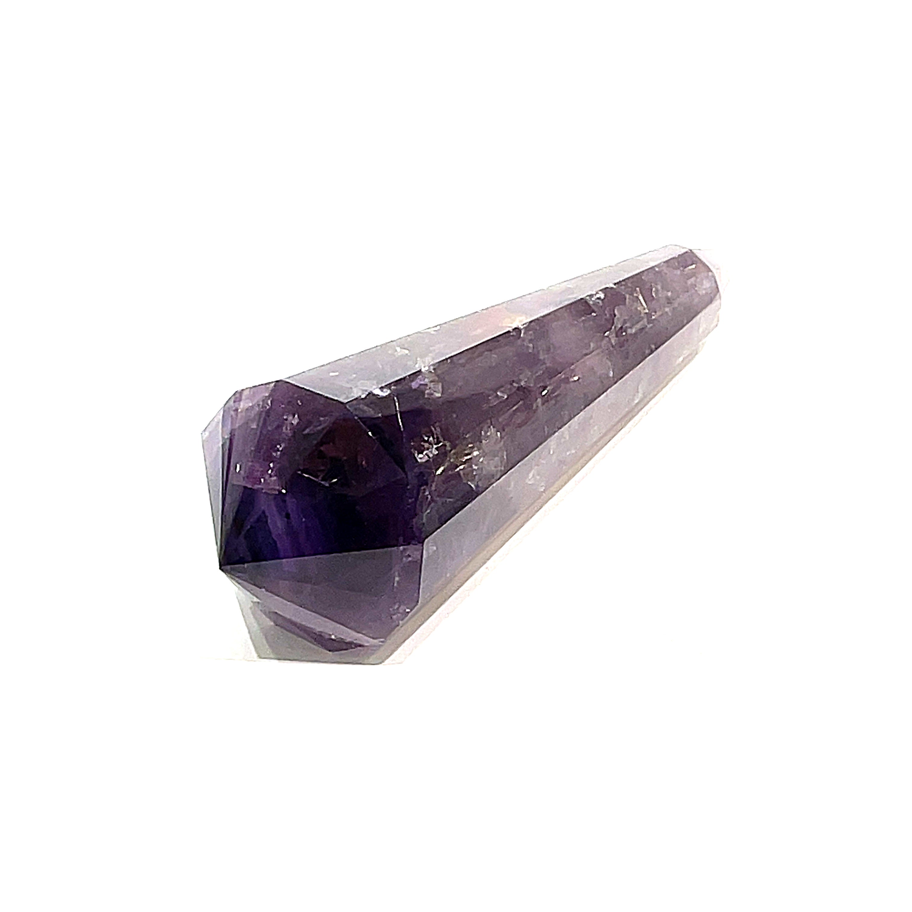 An extra-large, polished purple Amethyst Vogel gemstone on a white background, front point overview. 