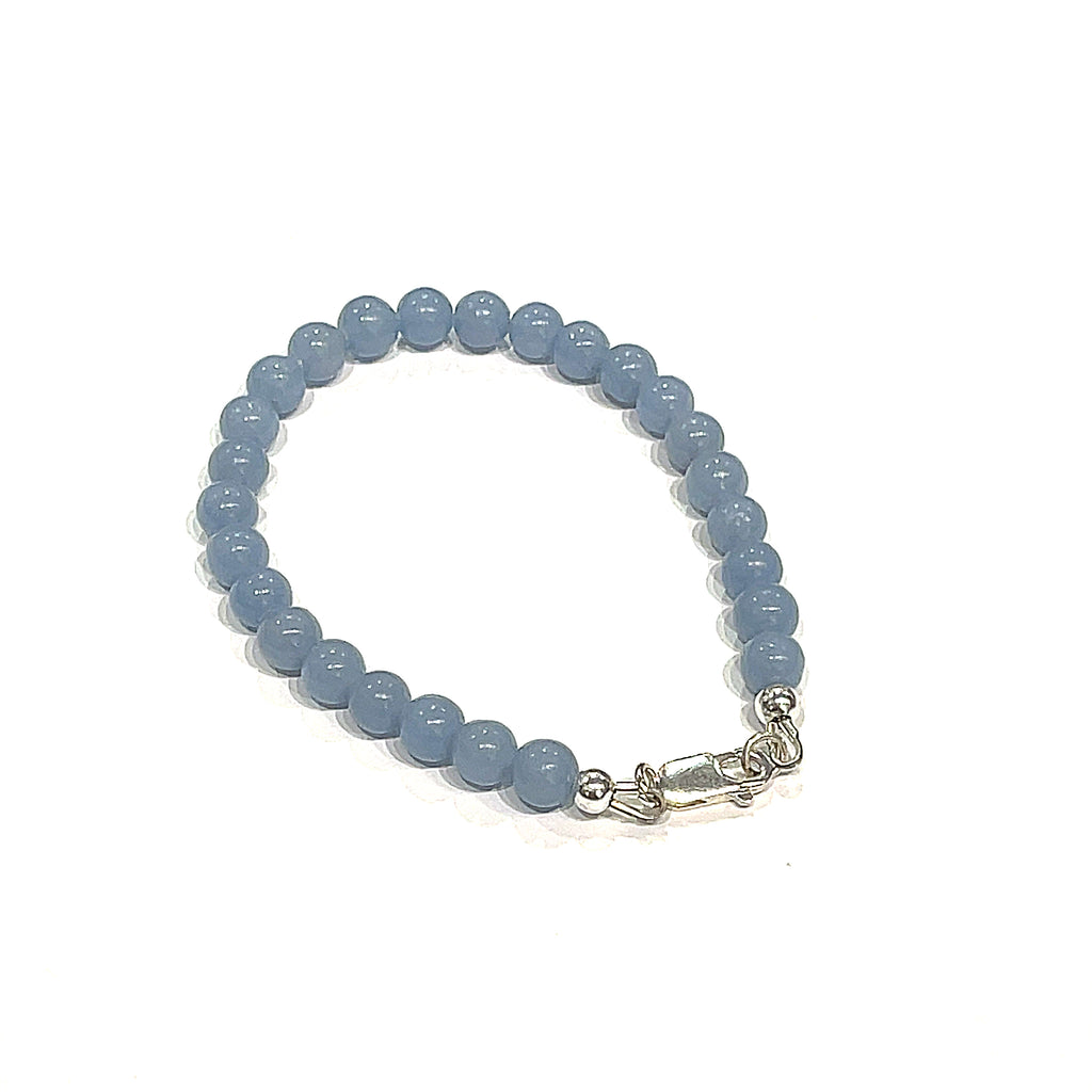 Angelite gemstone bracelet with 6mm smooth blue beads and Sterling Silver toggle clasp from Hidden Jewel of the South End on a white background back overview.