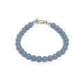 Angelite gemstone bracelet with 6mm smooth blue beads and Sterling Silver toggle clasp from Hidden Jewel of the South End on a white background front overview.