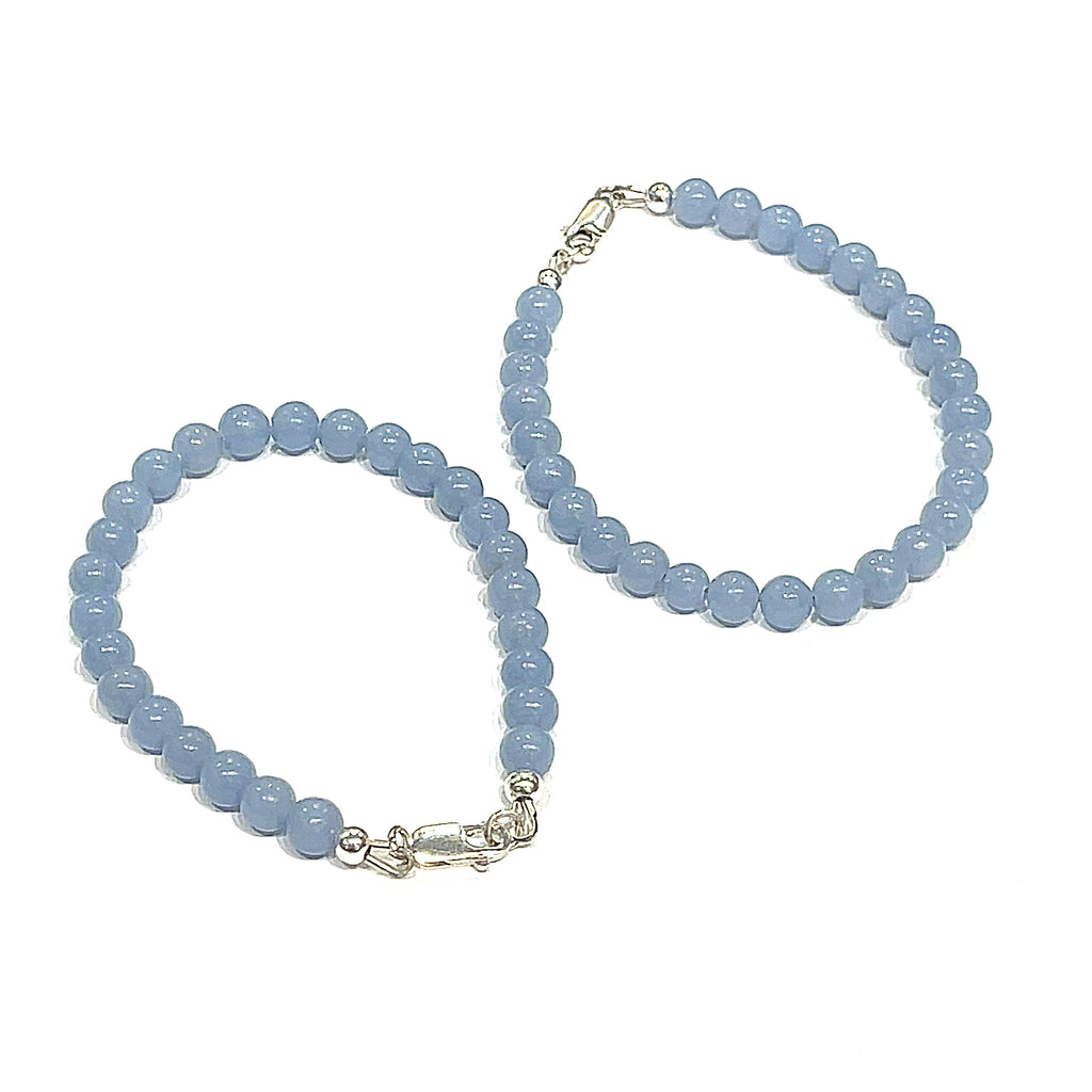 Angelite gemstone bracelet with 6mm smooth blue beads and Sterling Silver toggle clasp from Hidden Jewel of the South End on a white background overview.