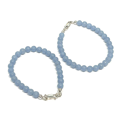 Angelite gemstone bracelet with 6mm smooth blue beads and Sterling Silver toggle clasp from Hidden Jewel of the South End on a white background overview.