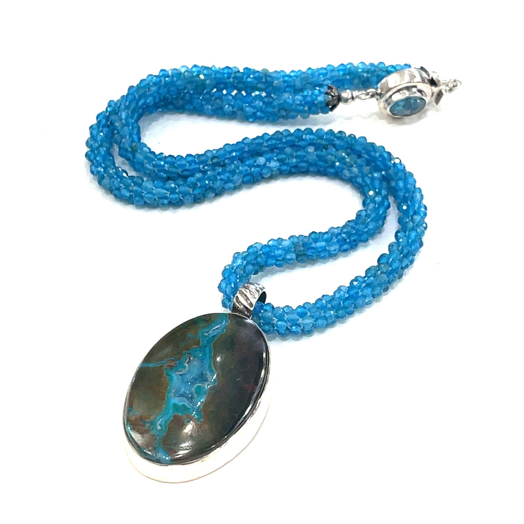 Blue Apatite crocheted gemstone necklace with Gem Silica Druzy pendant handmade by Hidden Jewel. on a white background center overview.