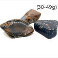 Blue Tiger Eye Tumbled Gemstone grouping on white30-49g overview