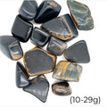 Blue Tiger Eye Tumbled Gemstone grouping on white 10-29g overview