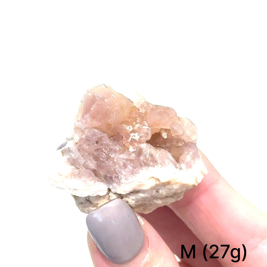 Close-up of AAA-grade Pink Amethyst cluster displaying translucent quartz and texture on white # M (27g) front view