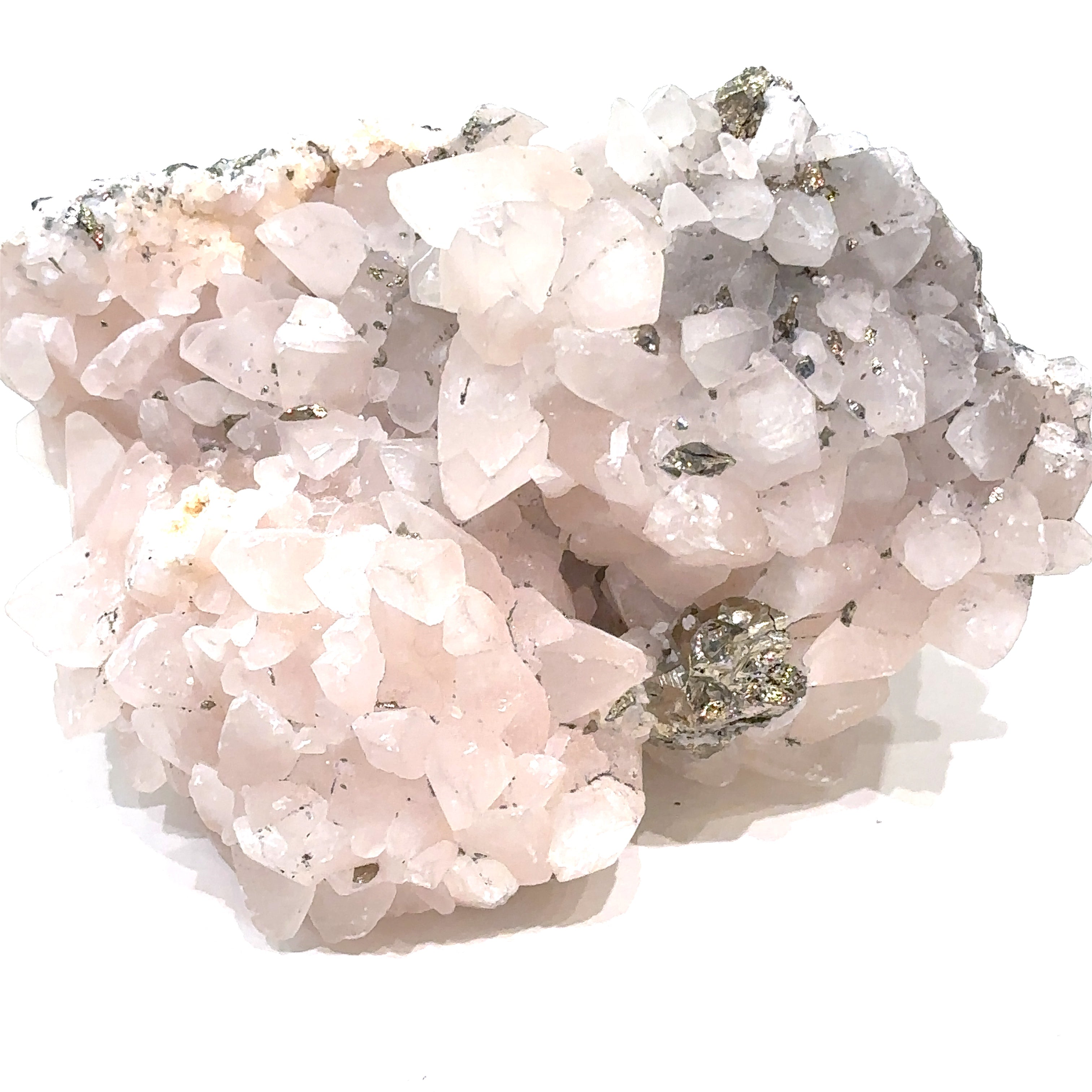 Close-up of Calcite and Fluorite crystal cluster with metallic Pyrite flecks on white background front view