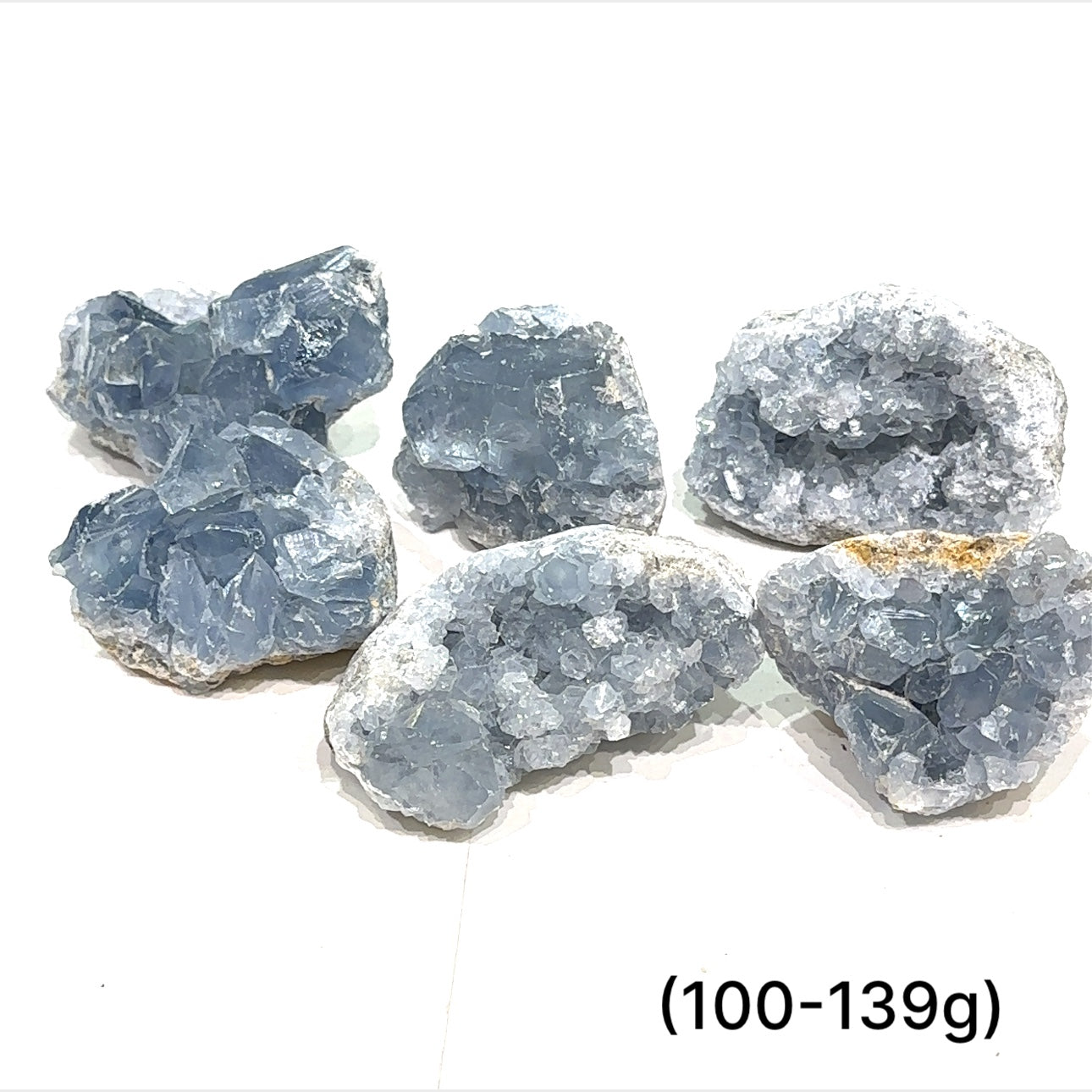 Close-up of Celestite crystal structure showing natural translucence on a white background group sizing (100-139g)