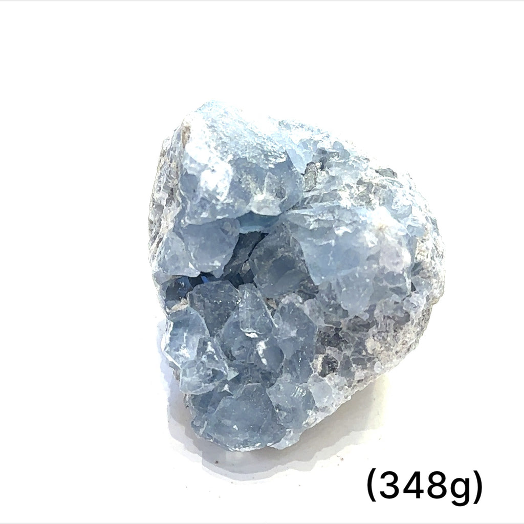 Close-up of Celestite crystal structure showing natural translucence on a white background group sizing (348g)