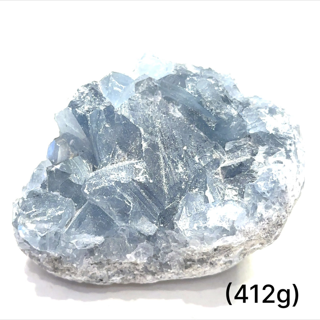 Close-up of Celestite crystal structure showing natural translucence on a white background group sizing (412g)