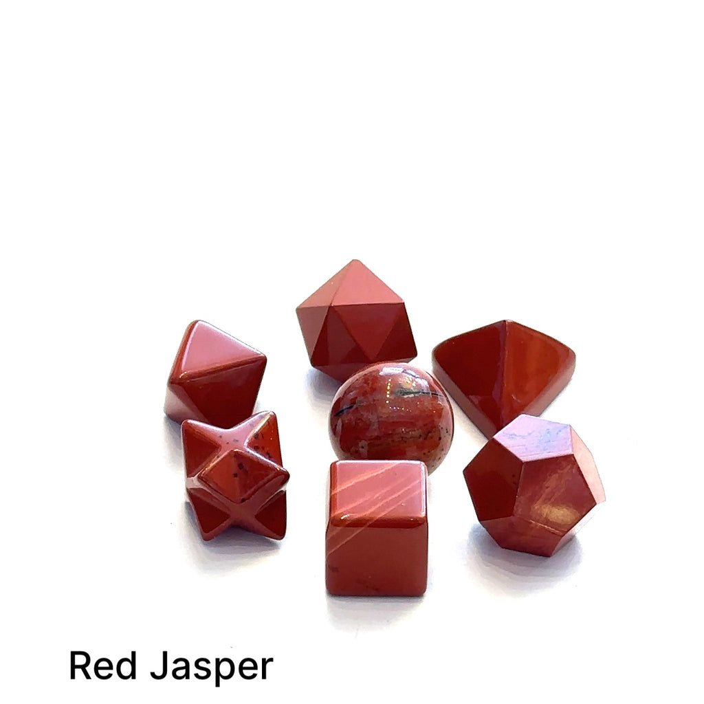 Close-up of Red Jasper sacred geometry stones showing polished detail on white overview