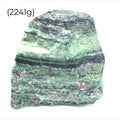 Close-up of raw Ruby in Zoisite showing natural red ruby within green Zoisite matrix (2241g) on a white background front overview. 
