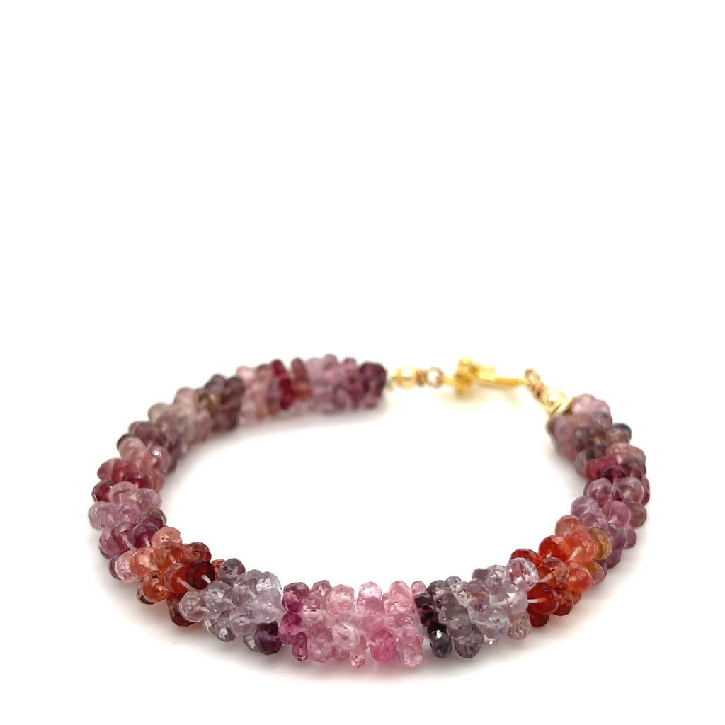 Crocheted Red Spinel bracelet — passion and vitality healing jewelry on a white background center overview.