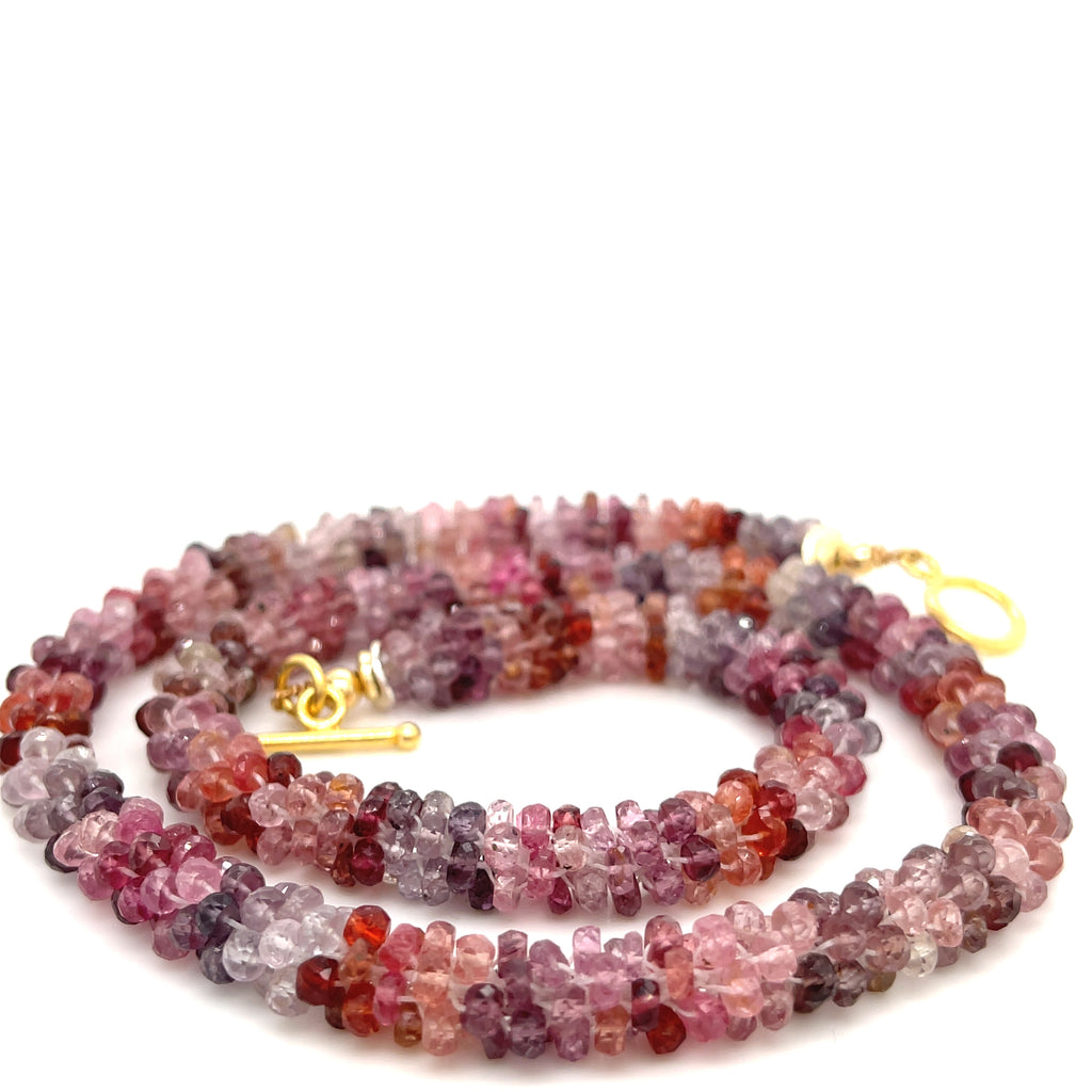 Crocheted Red Spinel necklace with gold-filled toggle — handmade in Boston on a white background spiral overview.