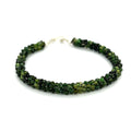 Emerald bracelet styled for everyday elegance or special occasions – a symbol of love and abundance. On a white background center overview. 