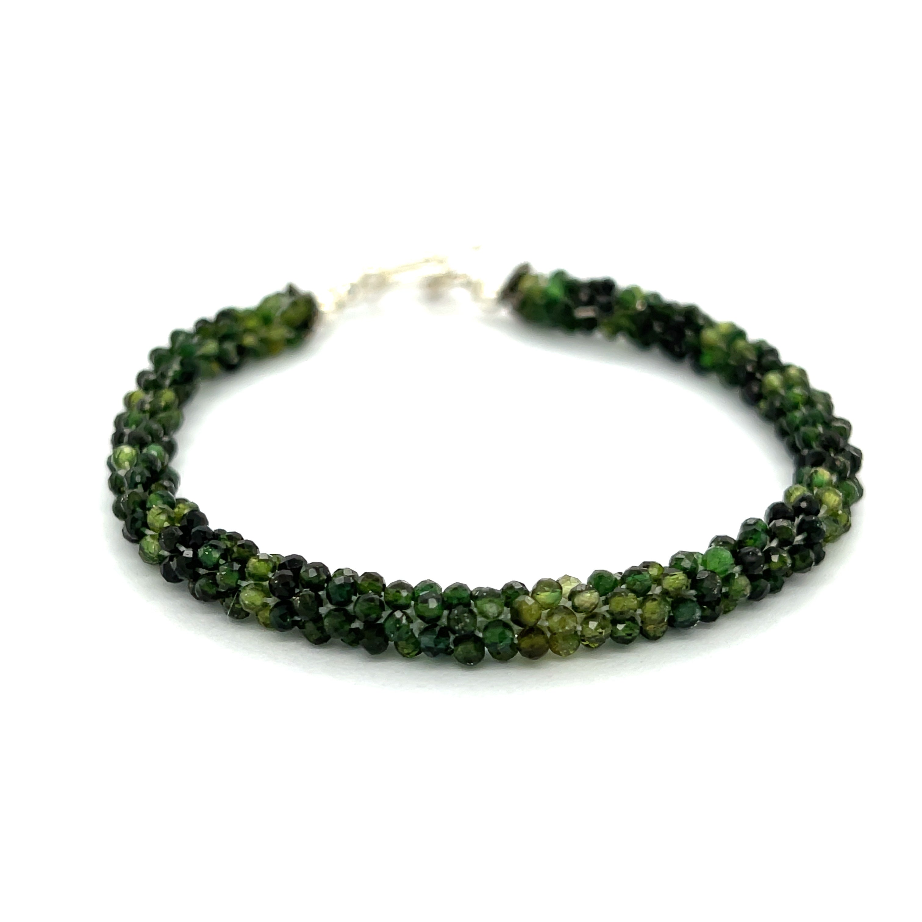 Emerald bracelet styled for everyday elegance or special occasions – a symbol of love and abundance. On a white background center overview. 