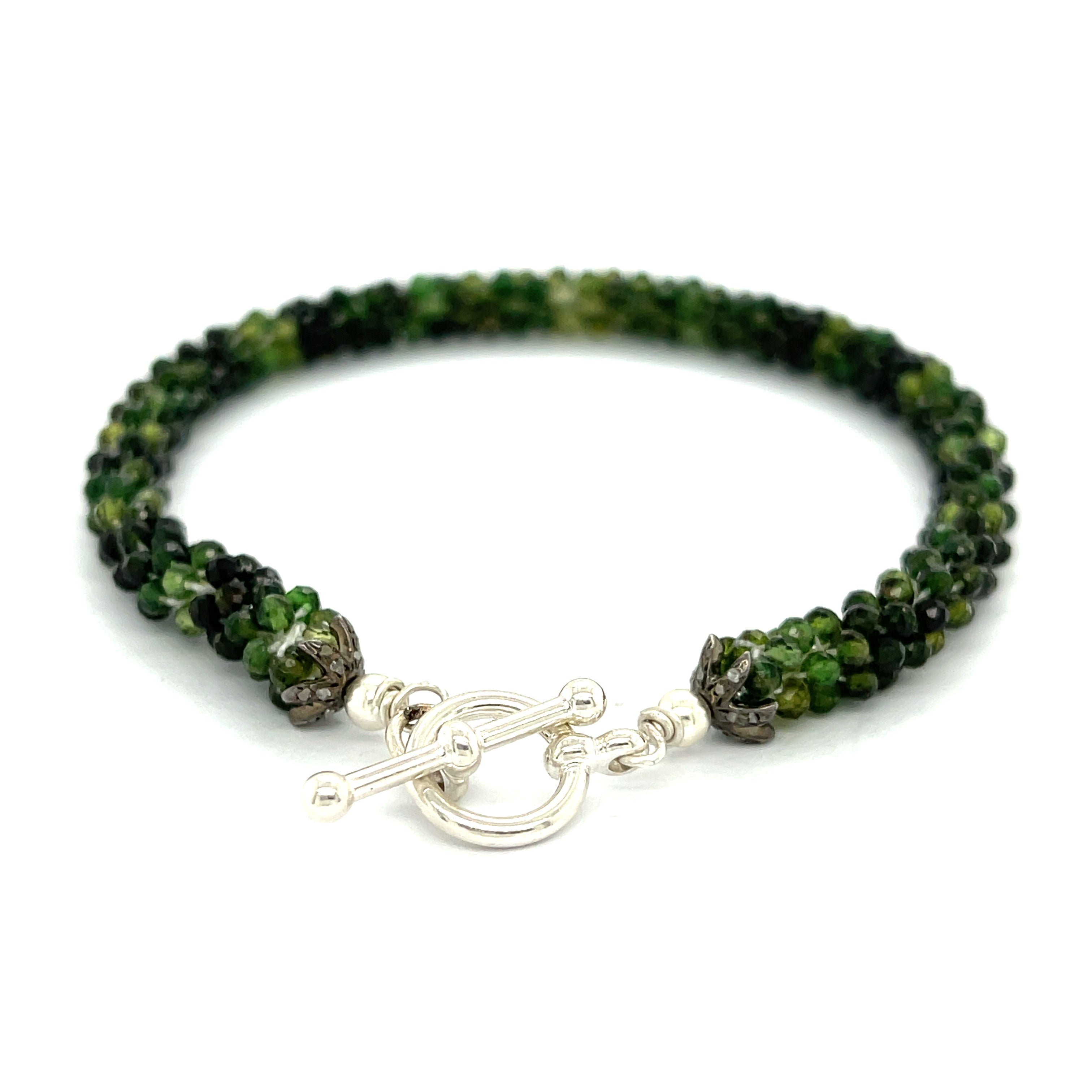 Emerald bracelet styled for everyday elegance or special occasions – a symbol of love and abundance. On a white background  center toggle overview. 