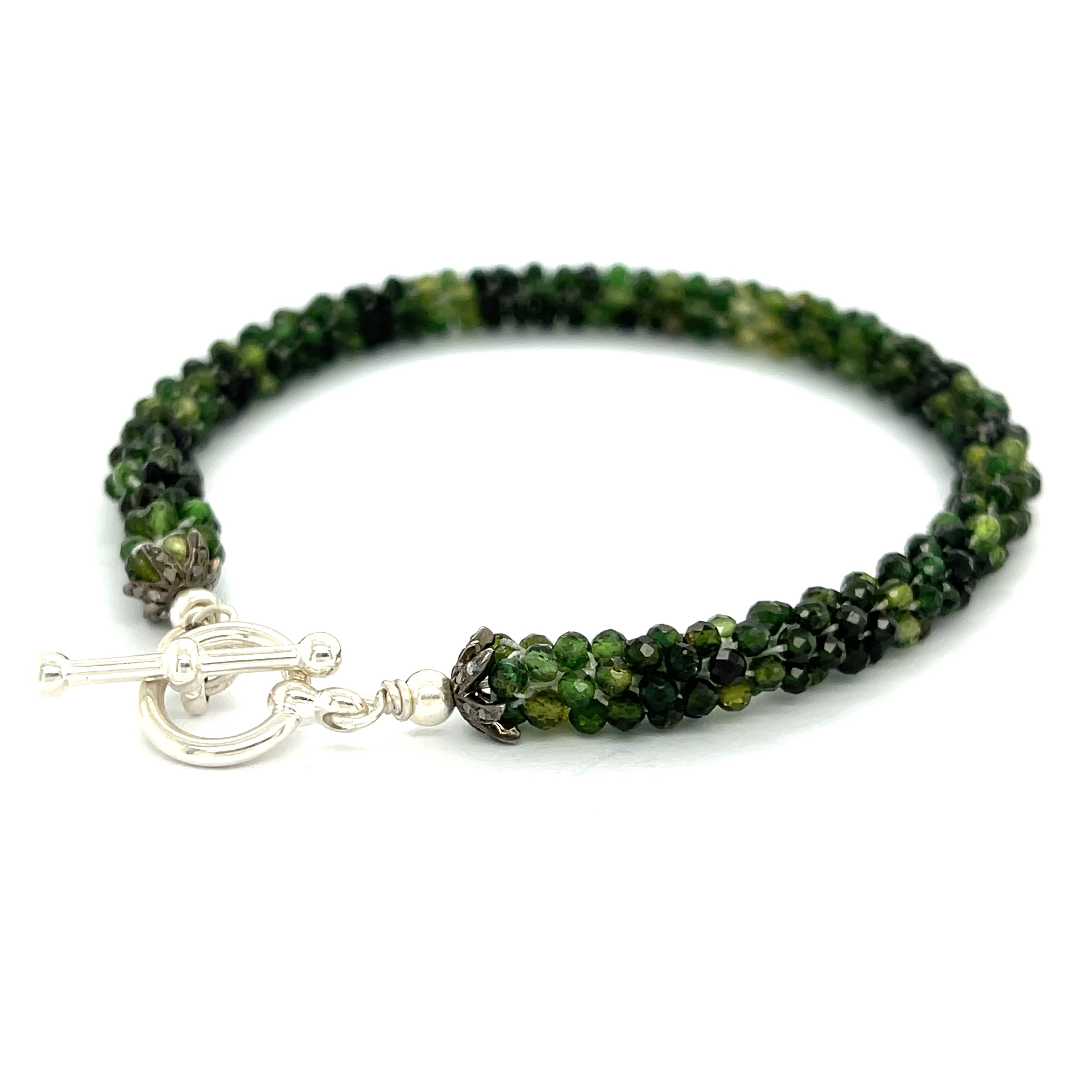 Emerald bracelet styled for everyday elegance or special occasions – a symbol of love and abundance. On a white background left angle  toggle overview. 
