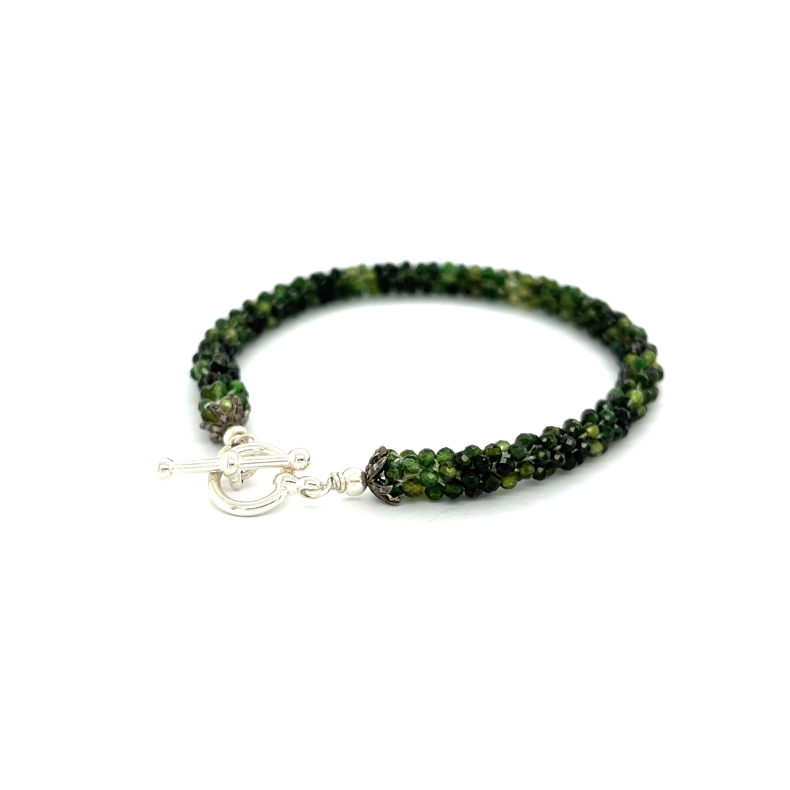 Emerald bracelet styled for everyday elegance or special occasions – a symbol of love and abundance. On a white background  left side toggle overview.