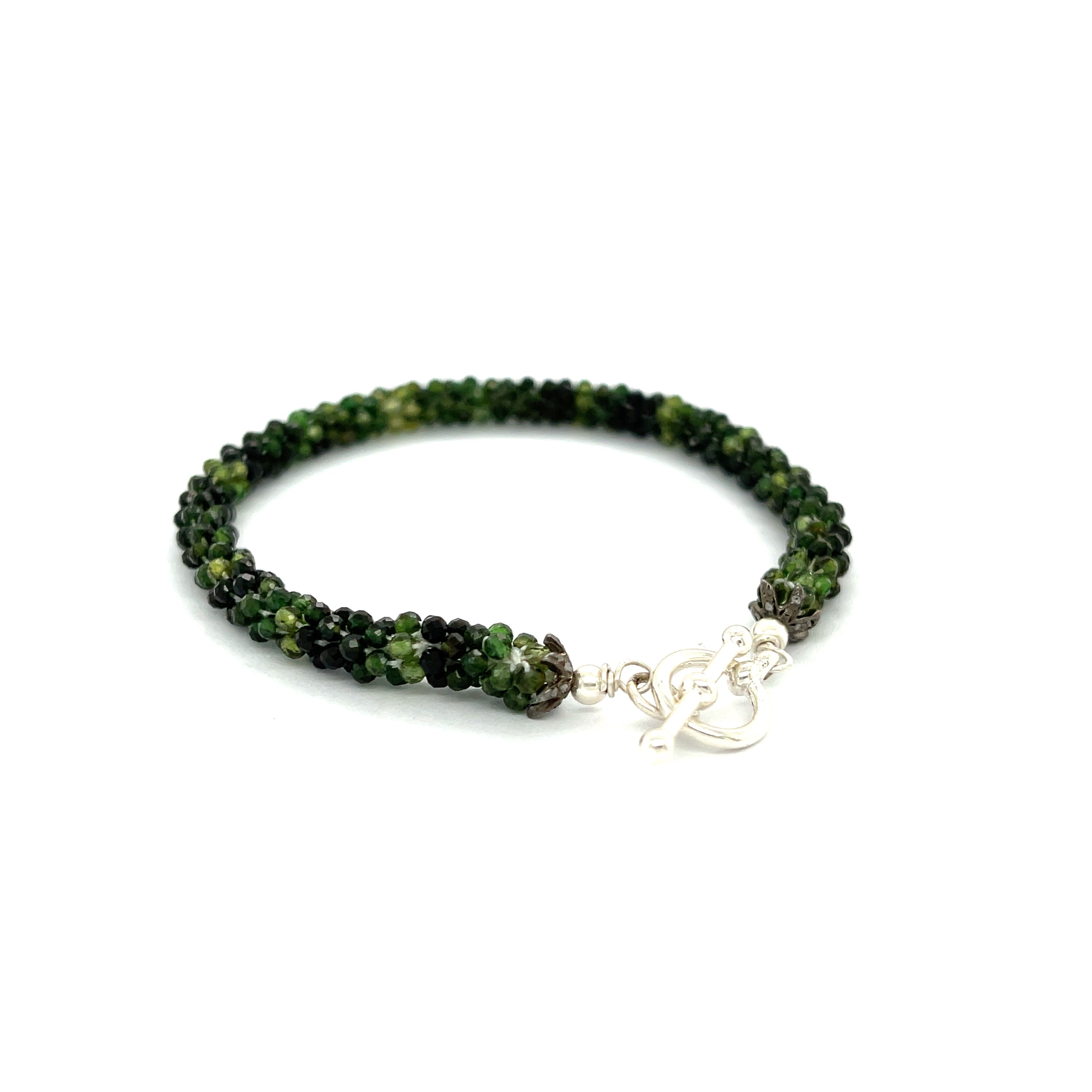 Emerald bracelet styled for everyday elegance or special occasions – a symbol of love and abundance. On a white background  right angle toggle overview.