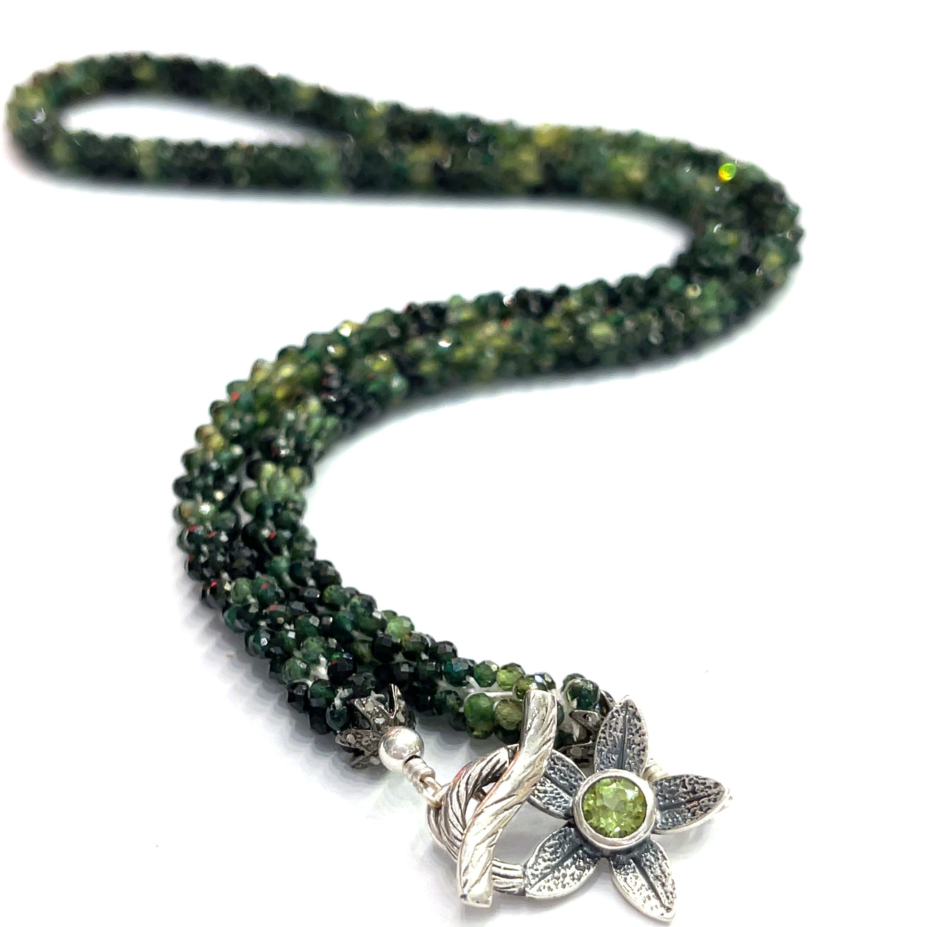 Emerald necklace styled for elegance and everyday wear – a timeless statement of love and abundance. on a white background long, center, back, toggle close up overview. 