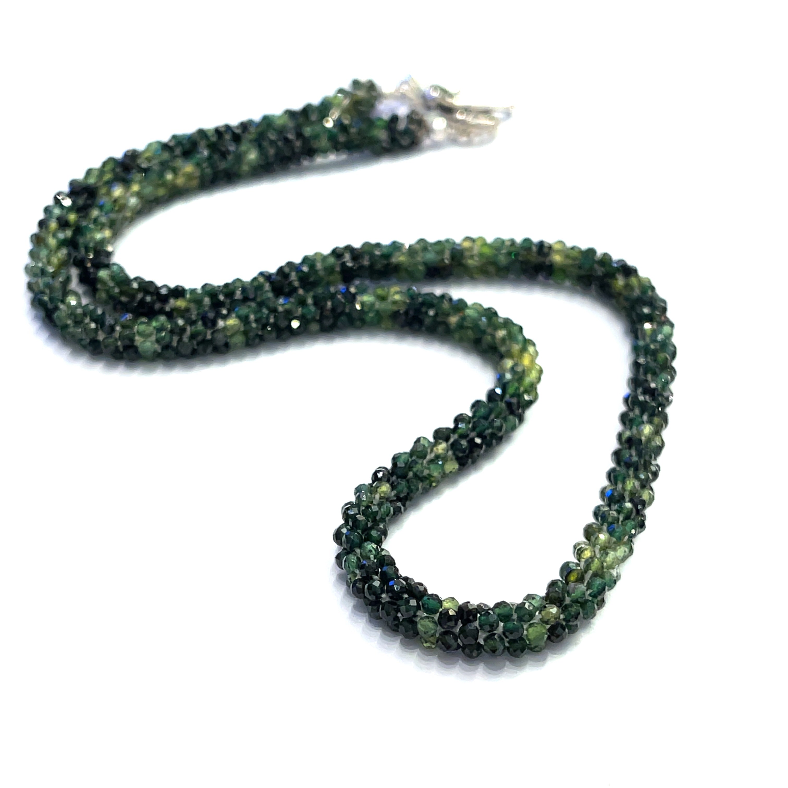 Emerald necklace styled for elegance and everyday wear – a timeless statement of love and abundance. on a white background long, center, front overview. 