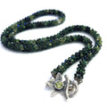 Emerald necklace styled for elegance and everyday wear – a timeless statement of love and abundance. on a white background long, center, toggle overview. 