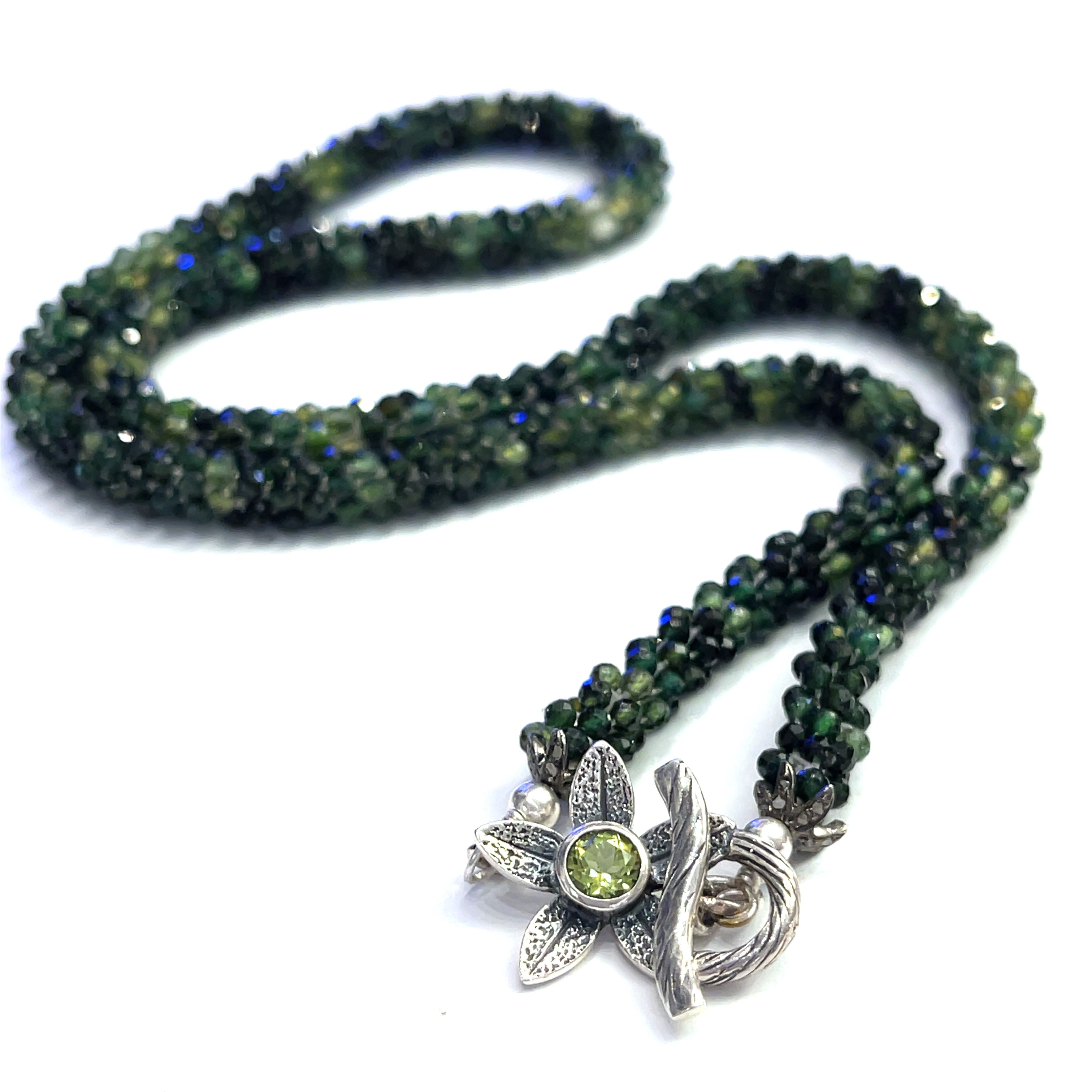 Emerald necklace styled for elegance and everyday wear – a timeless statement of love and abundance. on a white background long, center, toggle overview. 