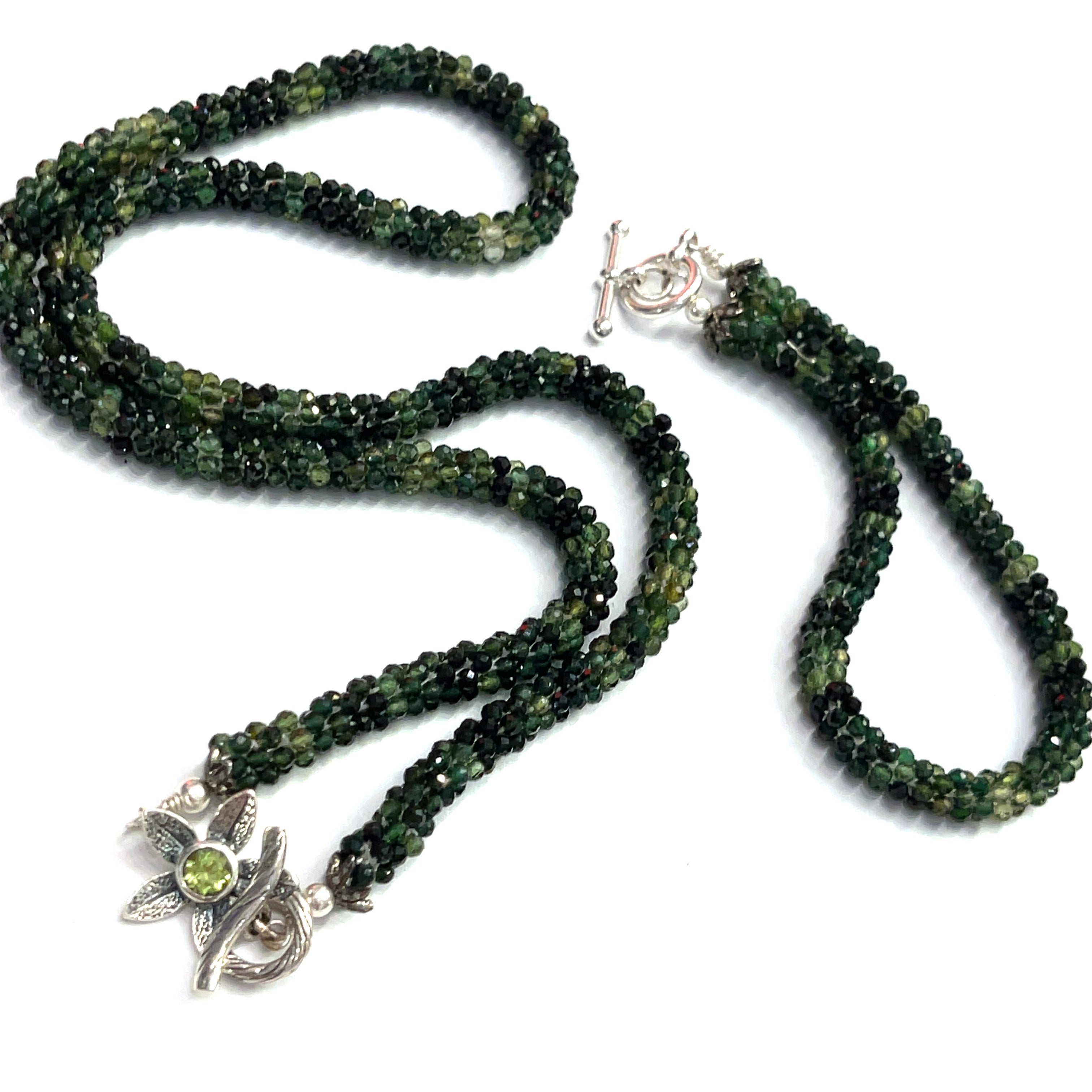 Emerald necklace styled for elegance and everyday wear – a timeless statement of love and abundance. with its matching bracelet on a white background long, center, toggle overview. 