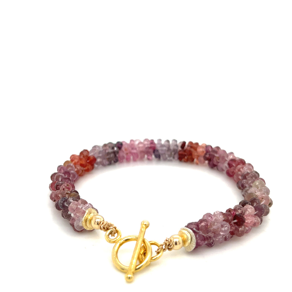 Faceted red gemstone bracelet — handmade spiritual jewelry on a white background toggle overview.