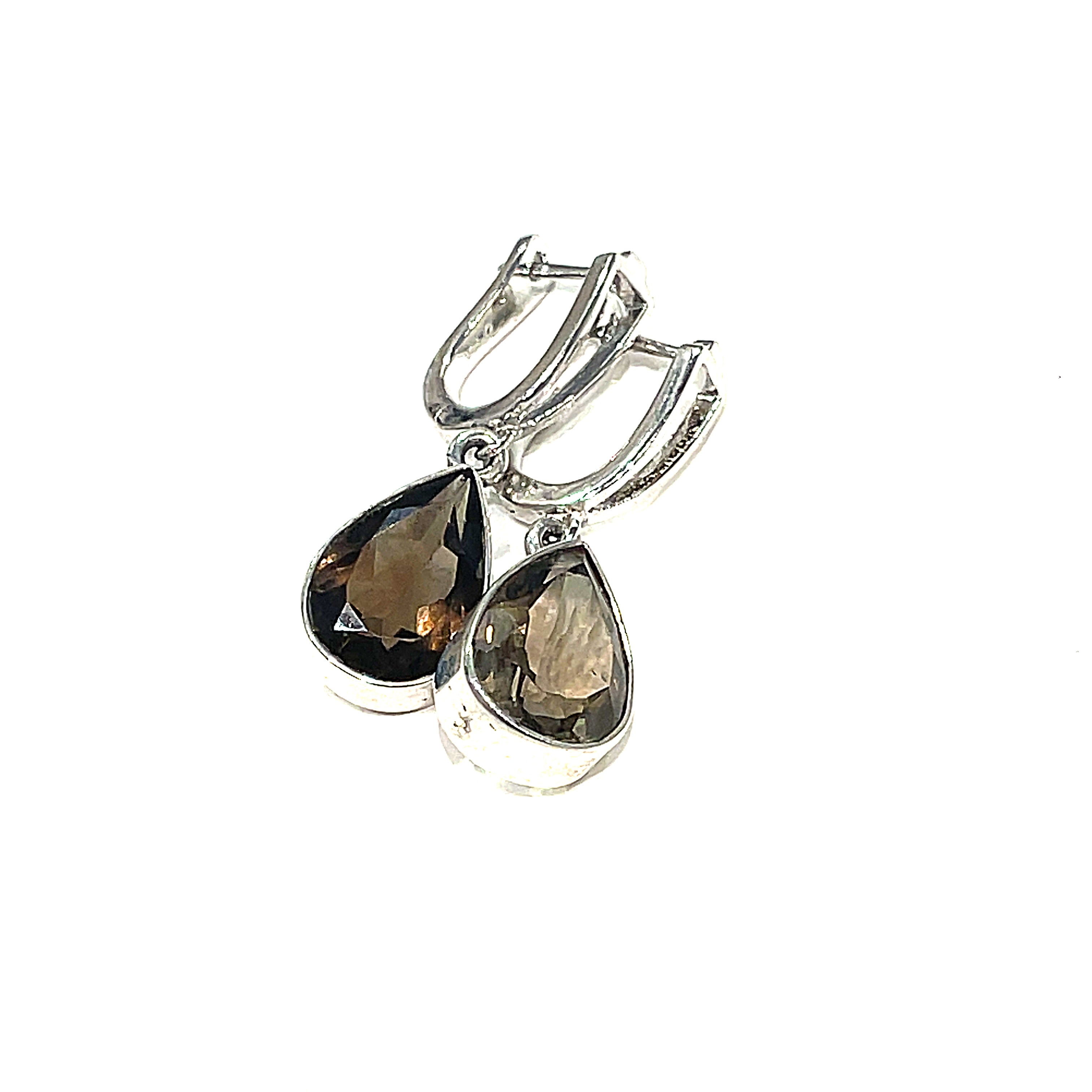 Gemstone Smokey Quartz faceted tear drop in a sterling silver bezel with split shank lever back earrings on a white background right angled overview. 