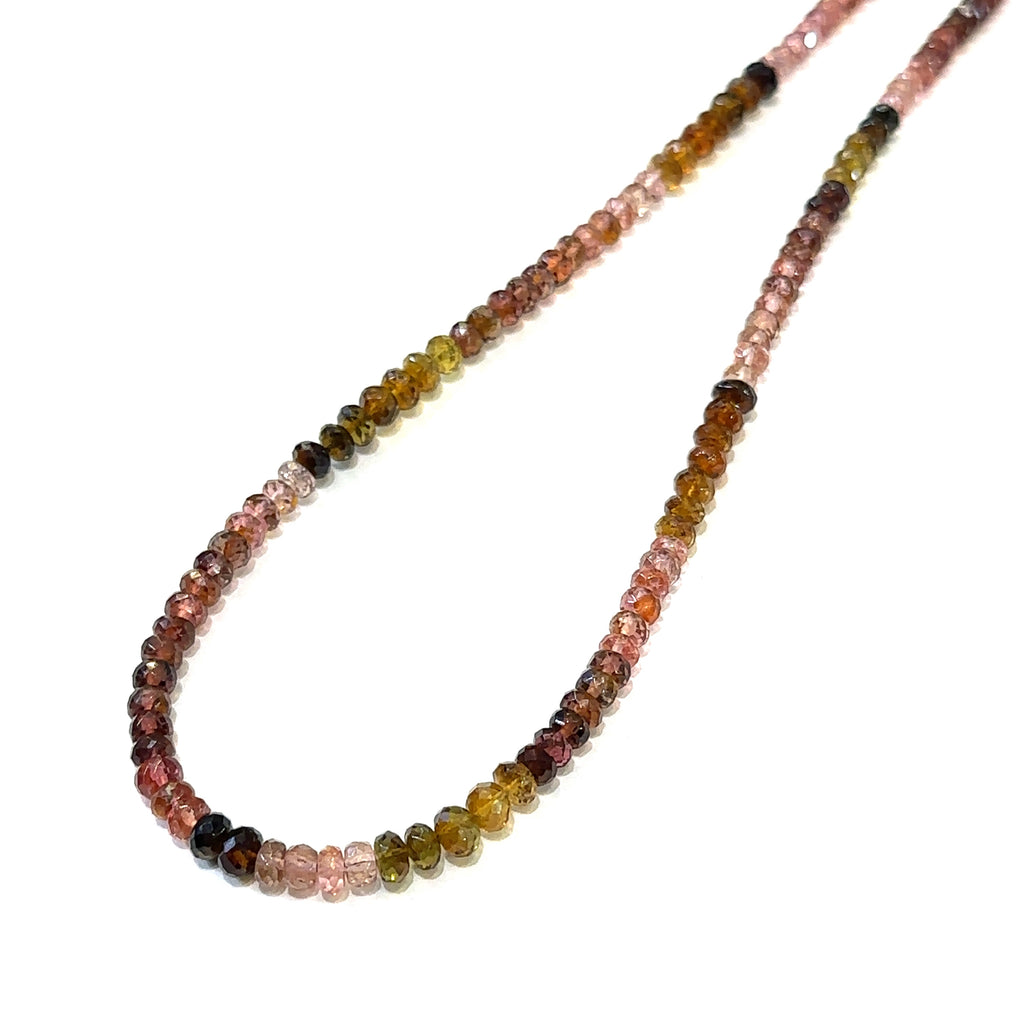 Genuine Multi Tourmaline gemstone necklace with sterling silver heart clasp by Hidden Jewel on a white background long hanging  overview.