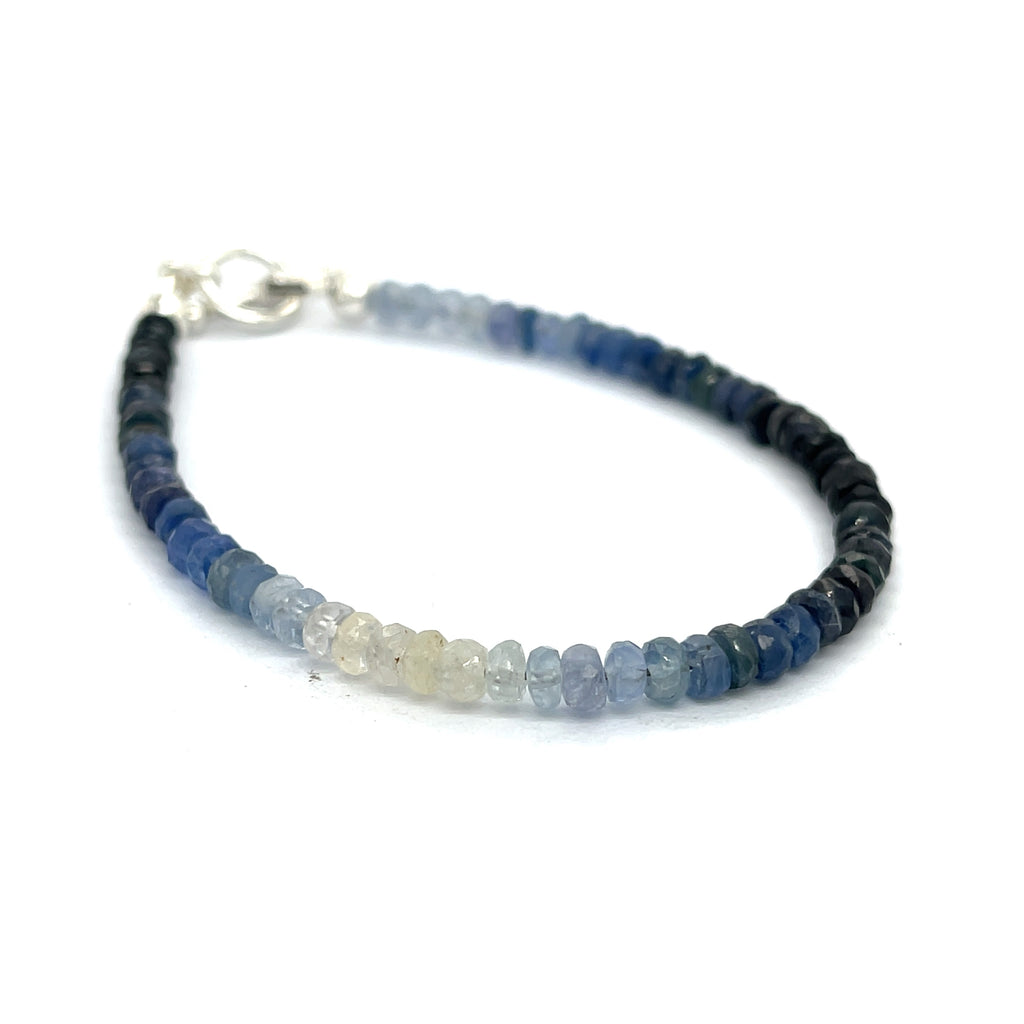 Genuine Sapphire gemstone bracelet with sterling silver toggle clasp by Hidden Jewel on a white background front angle overview. 