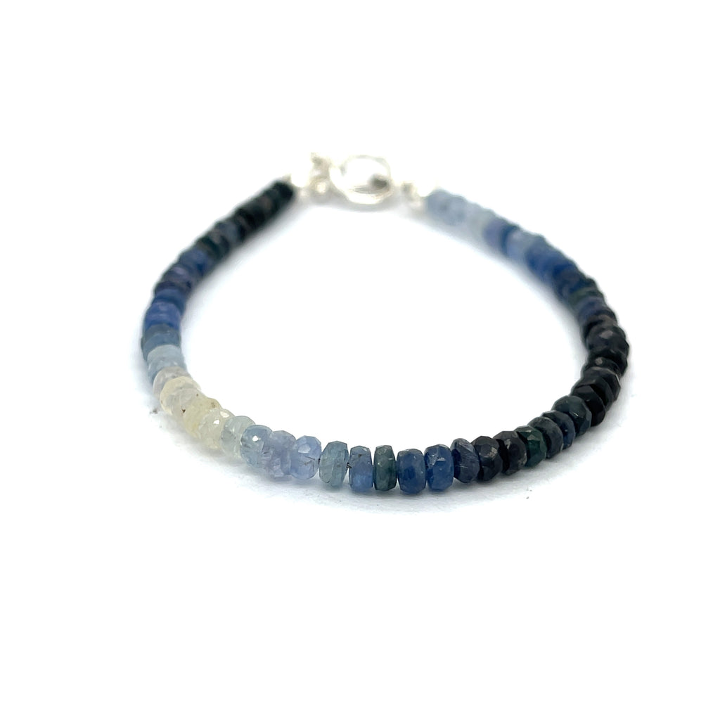 Genuine Sapphire gemstone bracelet with sterling silver toggle clasp by Hidden Jewel on a white background front overview. 